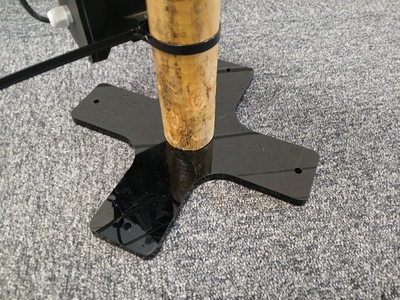 Wooden pole with cross-shaped foot