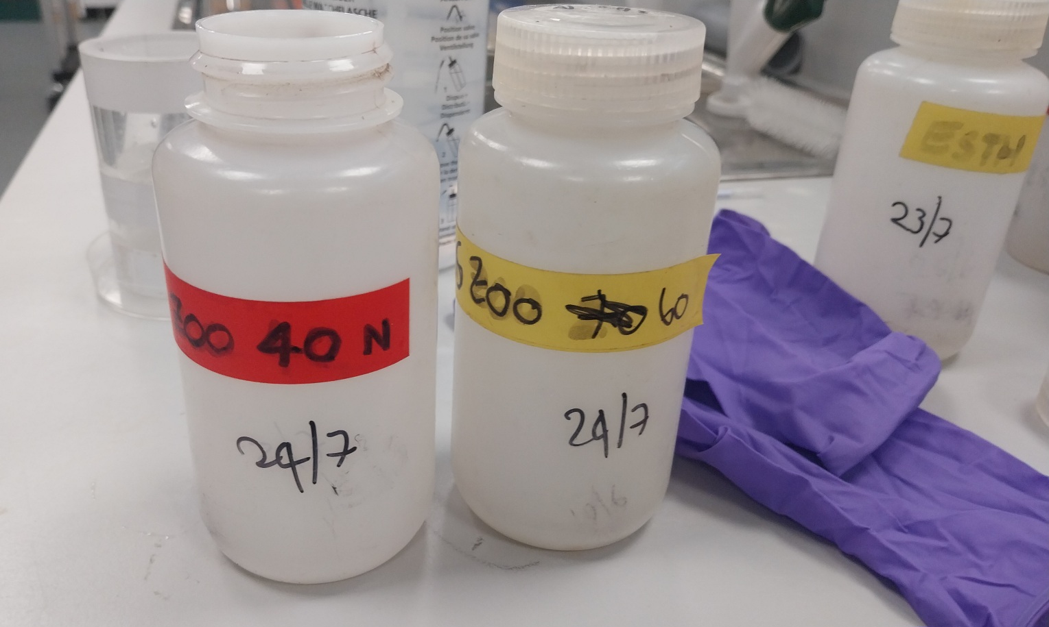 Sample jars marked with site, date, and depth